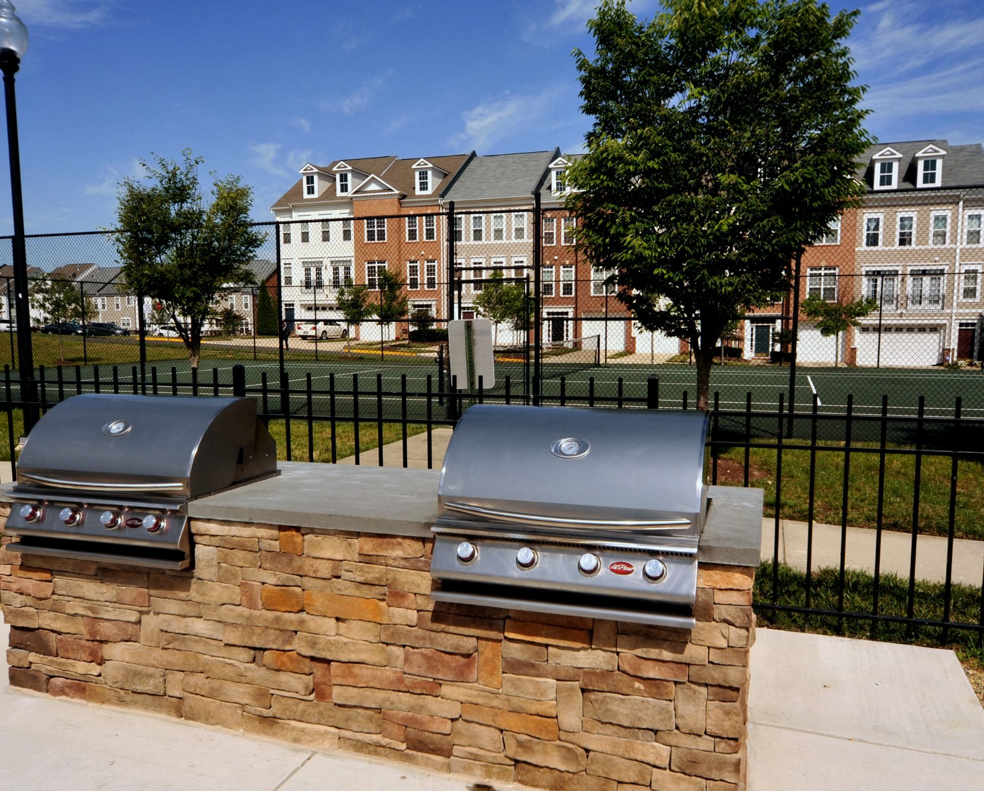 Amenities Outdoor Courtyard with Grilling Stations-MetroPlace at Town Center Apartments